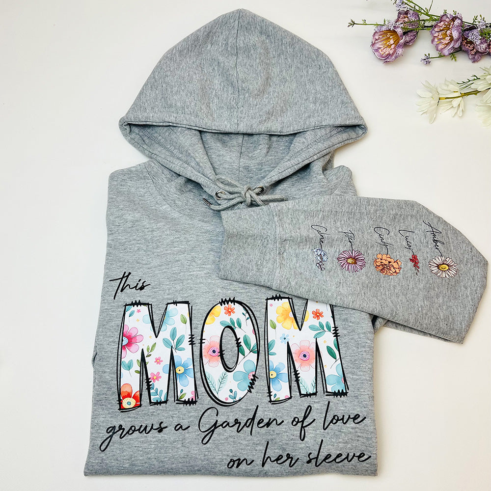 50%OFF⭐️Personalized This Mom Grows A Garden Of Love On Her Sleeve Birth Flower Hoodie